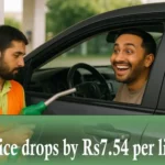 Petrol station worker refueling a car as a happy driver reacts to the new lower petrol price.